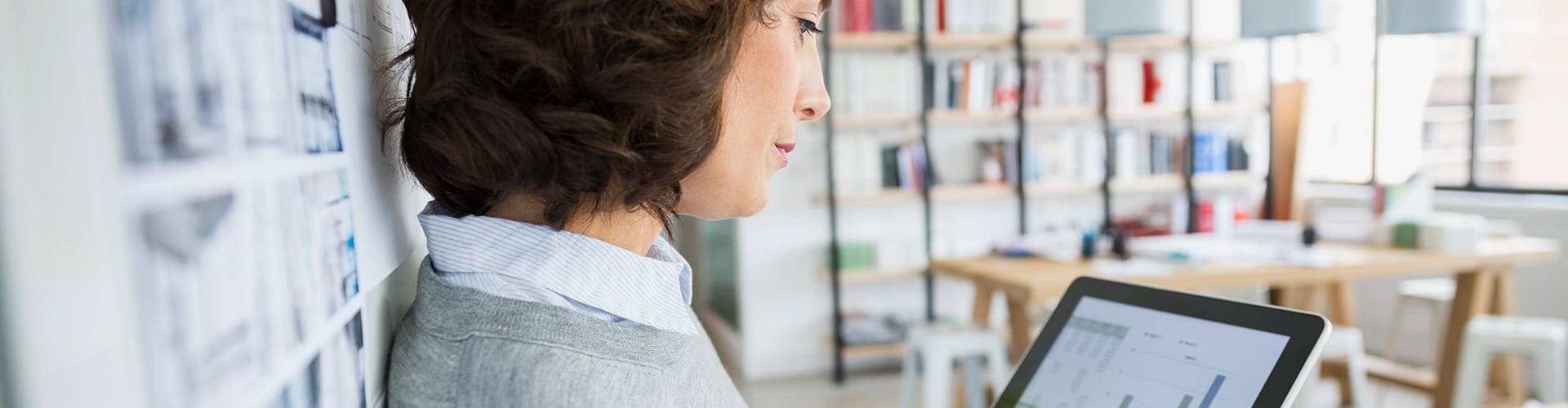 Woman looking at analytics on a tablet