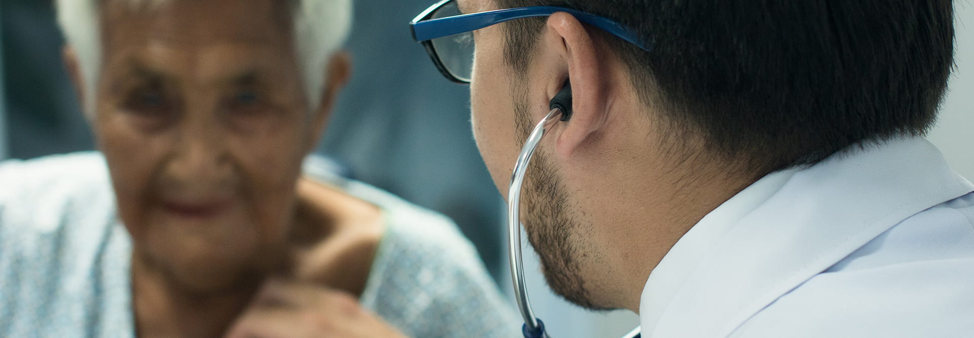 Doctor examining an elderly patient